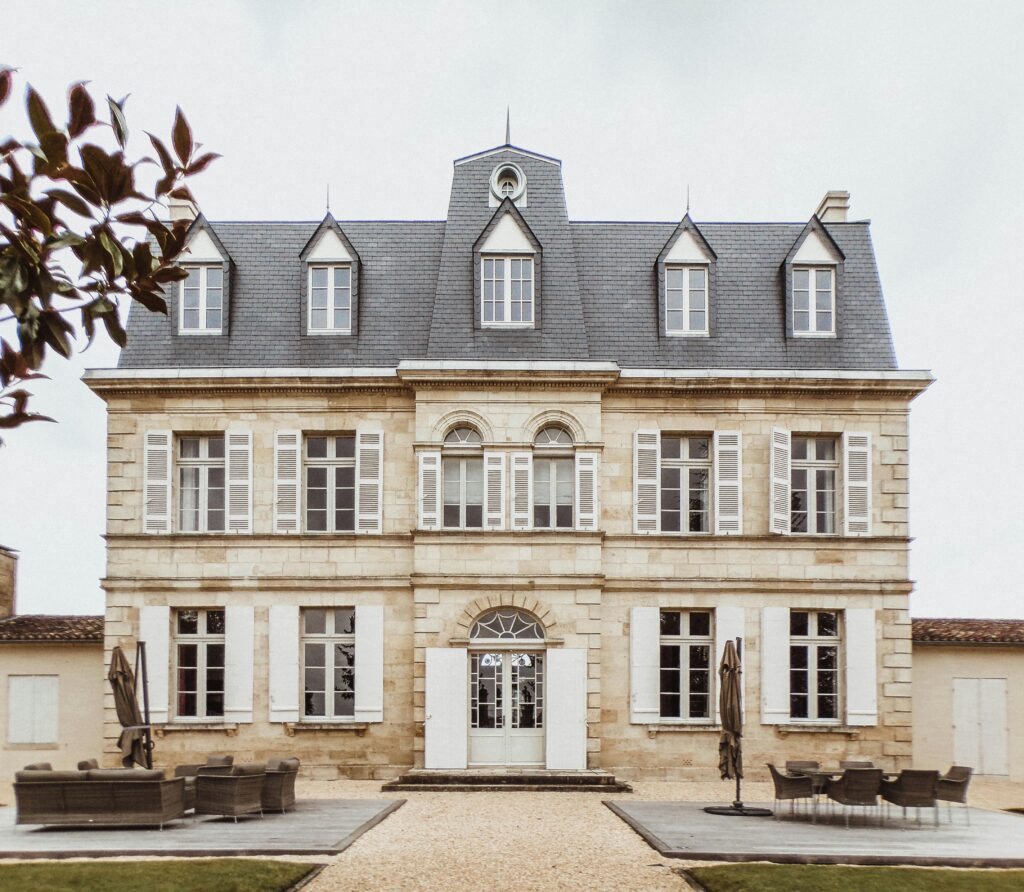 Charming facade of a classic French manor in Bordeaux, showcasing unique architecture.