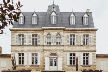 Charming facade of a classic French manor in Bordeaux, showcasing unique architecture.